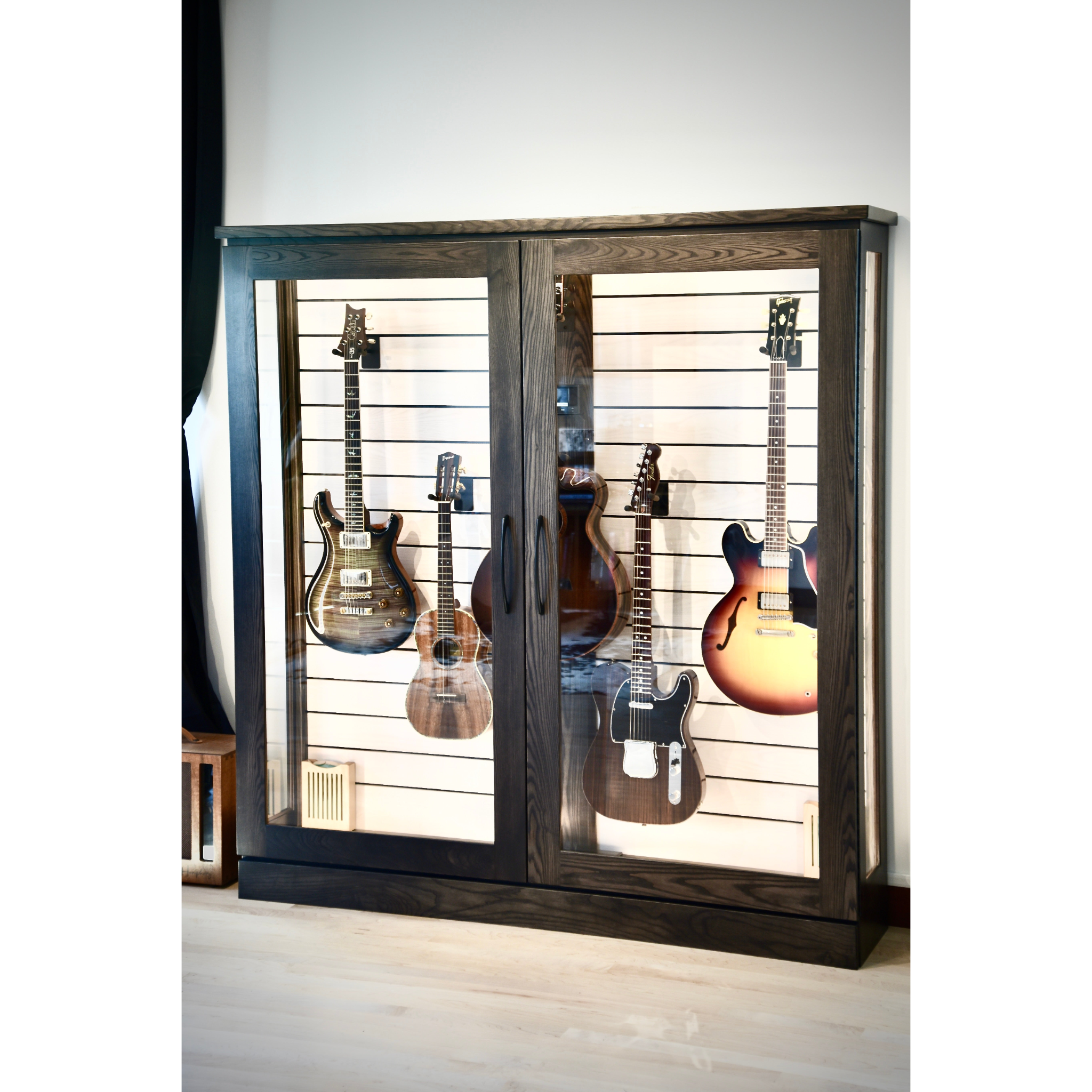 Guitar display cabinet with six guitars inside on a white background